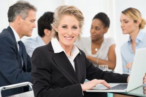 Portrait Of Smiling Mature Businesswoman Looking At Camera